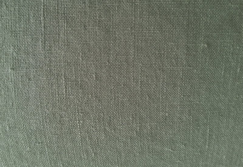 Темно зеленая ткань