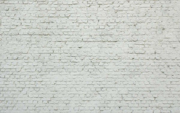 Старая белая кирпичная стена