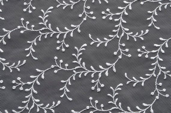 Текстура ткани с вышивкой