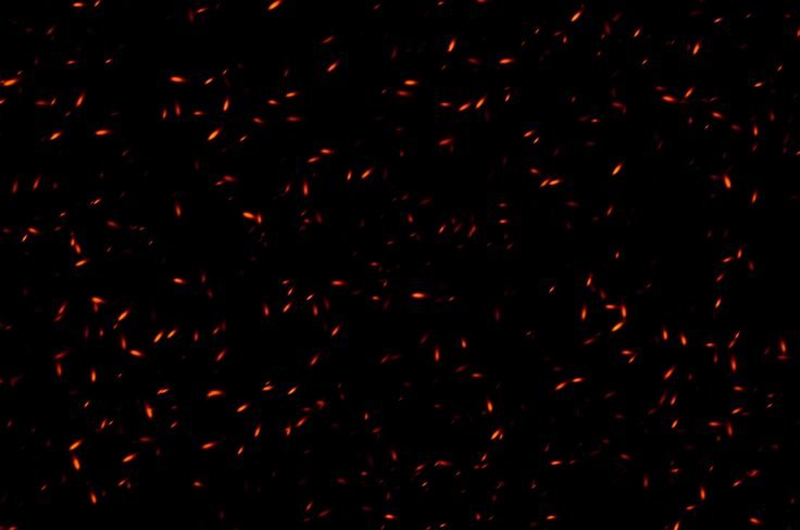 Пепел от костра на черном фоне