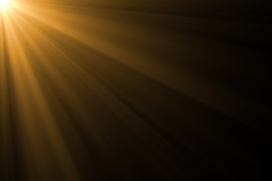 Лучи солнца на черном фоне