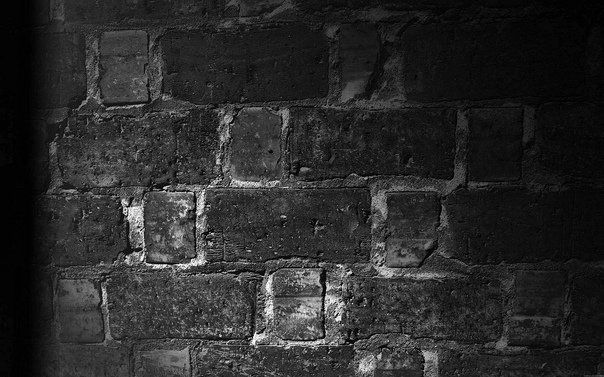 Серая кирпичная стена фон