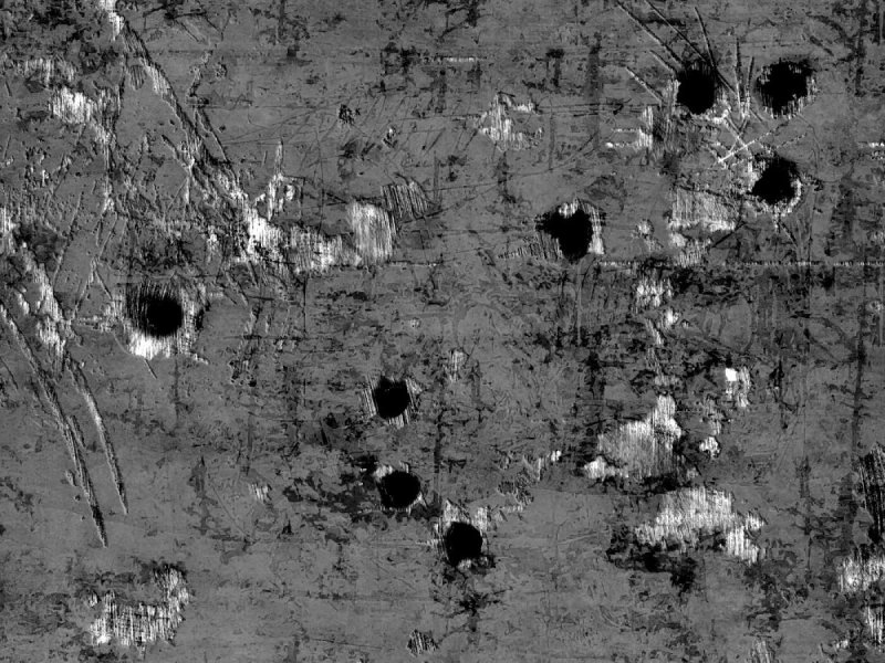 Пулевые отверстия в металле