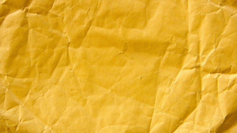 Желтая мятая бумага