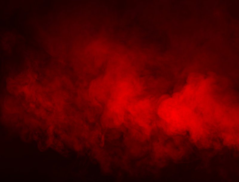 Красный дым на черном фоне