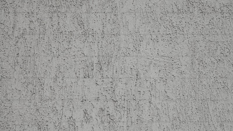 Короед штукатурка серая на стене