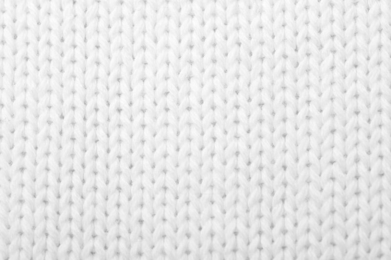 Белая вязаная ткань